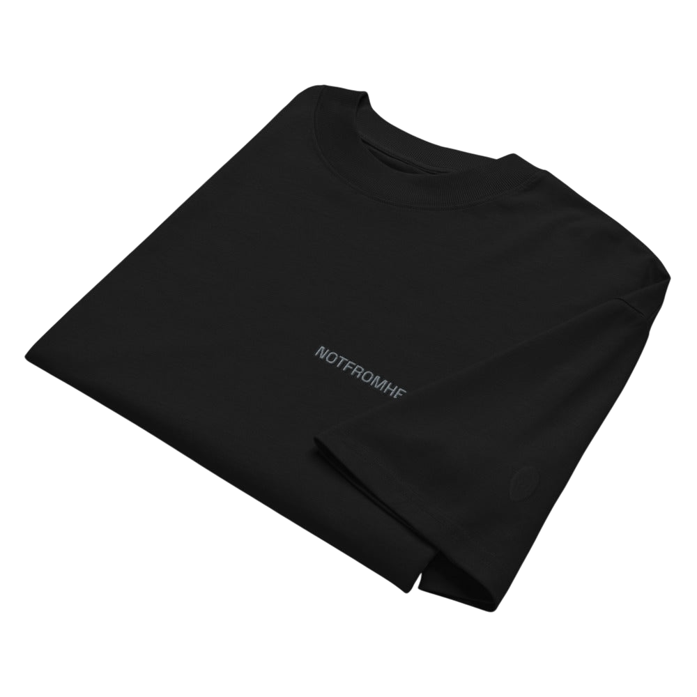 Folded ARTEFACT Série 01 oversized black t-shirt with minimal branding