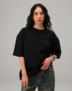 Woman wearing ARTEFACT Série 01 oversized high neck black t-shirt